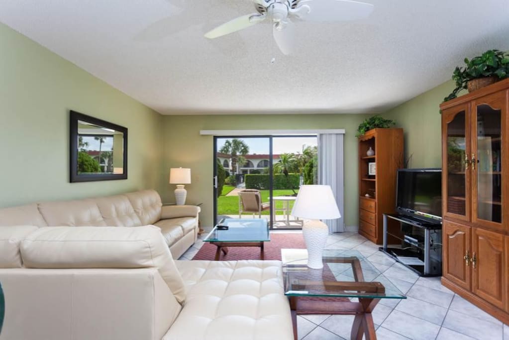 Relax in our open living room - sit back and enjoy HDTV! - Our open living room makes access to kitchen and dining super convenie