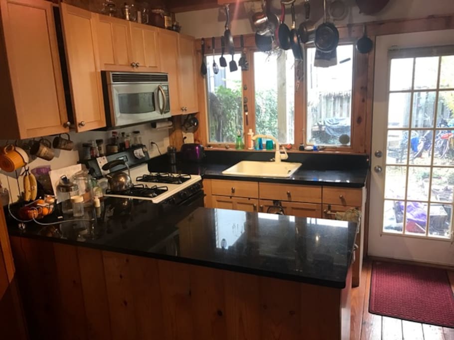 Kitchen, to your right the backdoor to patio.