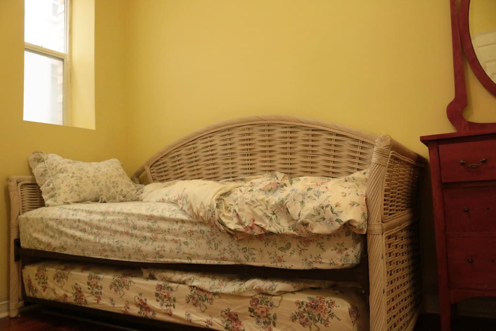 One of the single beds is in fact a trundle, and they fit neatly into each other.