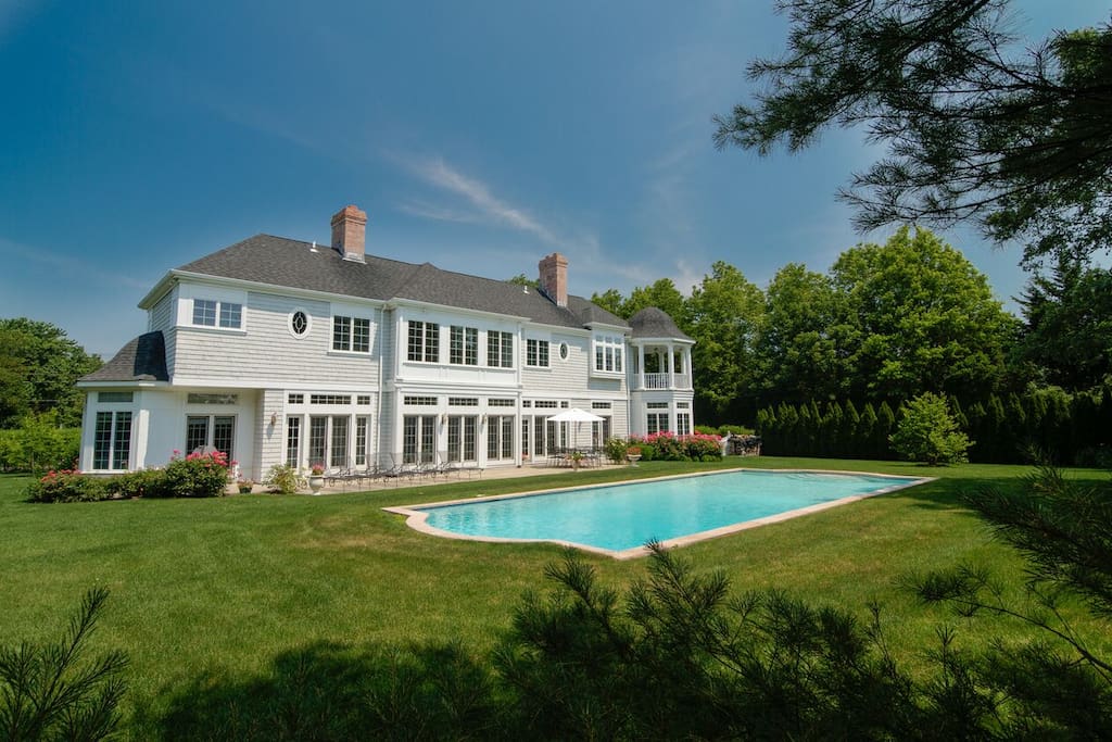 Manicured lawn and gardens affording total privacy.