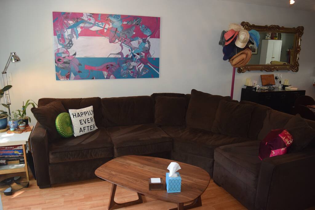 Our very cozy couch and local art!