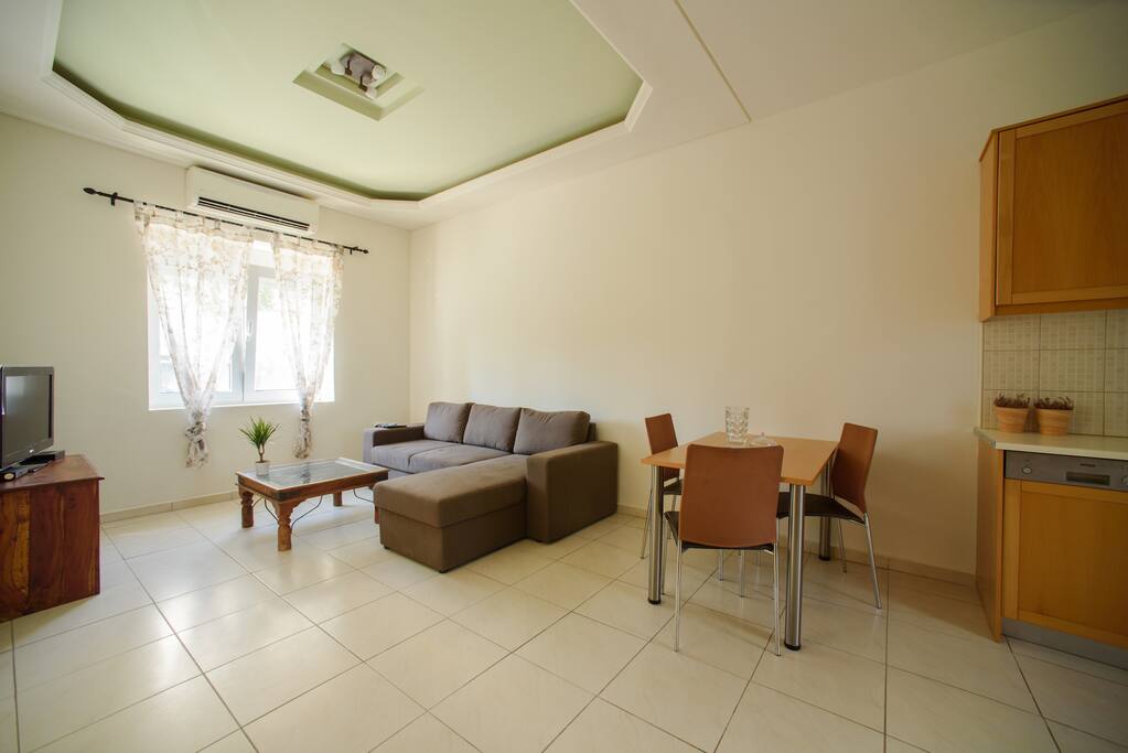 Living room with sofa bed & dining table