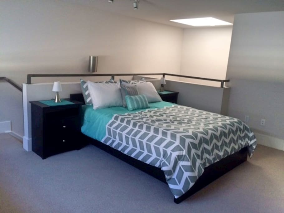 Comfy queen-sized bed in master sleep loft