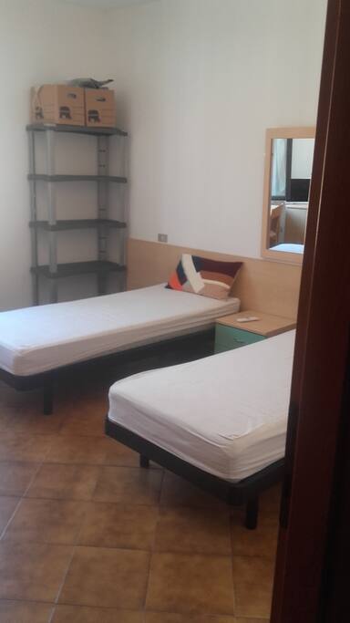 Camera da letto con 2 letti singoli che possono formare letto matrimoniale