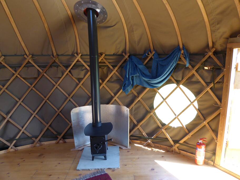 Wood burning stove, kindling and logs provided.
