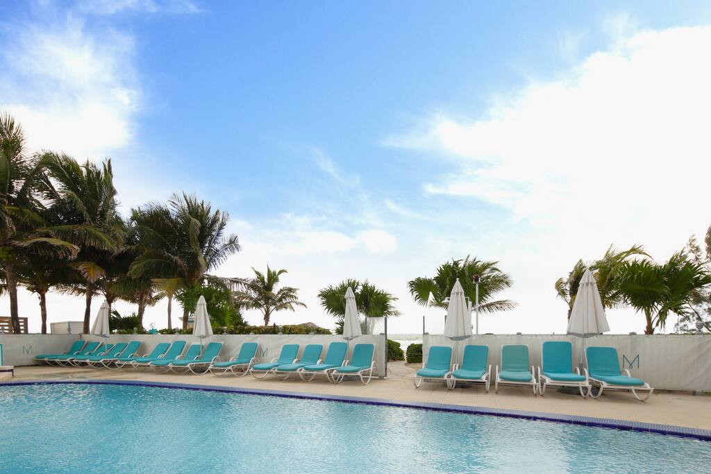 You can simply lounge by the pool and still enjoy the sea breeze