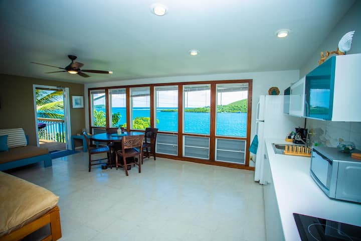 Ample Living Room Space with Stunning Ocean Views to Ensenda Honda Bay and Dakiti Nature Reserve. Exit to large private Terrace with Views to the Villa Dock and Fulladoza Bay. 