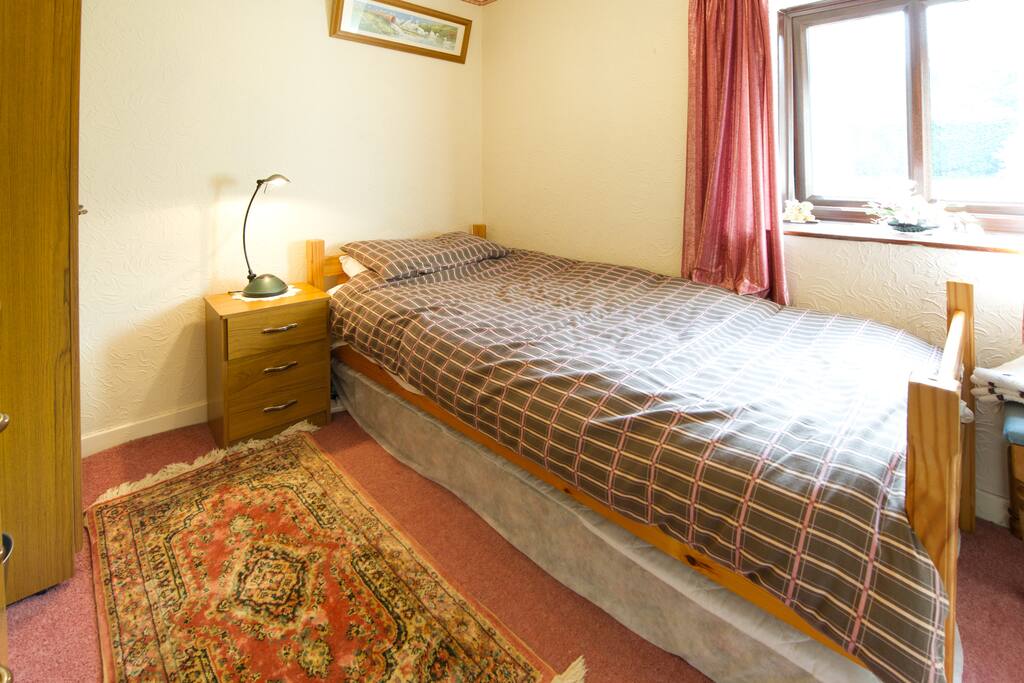 Bedroom 2 with single bed, with an additional pull out bed for the 4th guest.