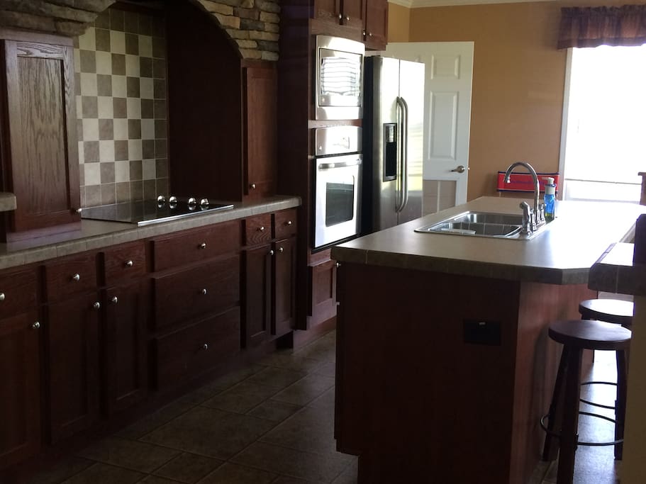 Stove top, oven, microwave, coffee maker, toaster oven. Spotless!