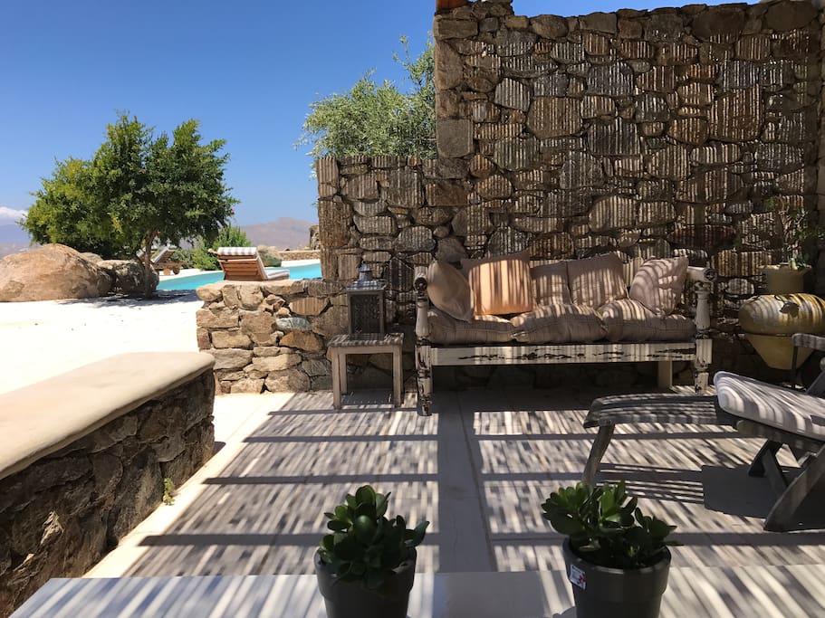 Private balcony at pool level with partial view of the pool.