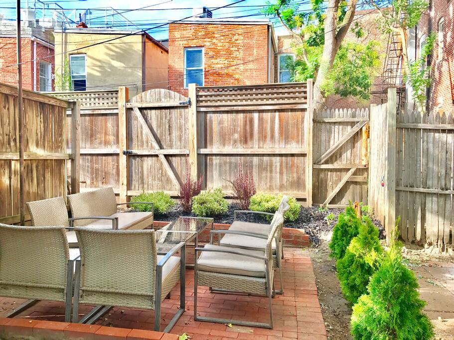 North side of outdoor patio (another table and grilling area to the left)