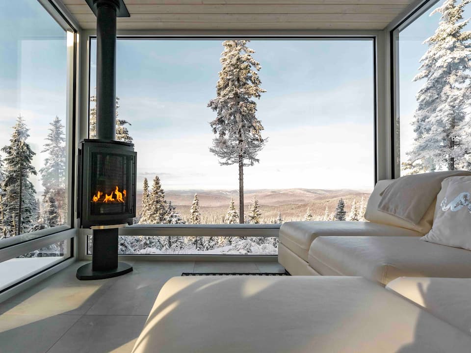 A glass tiny house on a mountaintop near Quebec City, Lac-Beauport, Quebec, Canada, photo 1 of 10