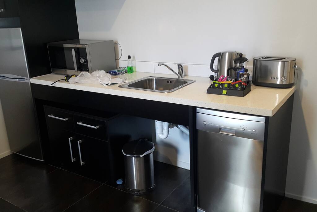 Kitchenette with dish washer and electric stove