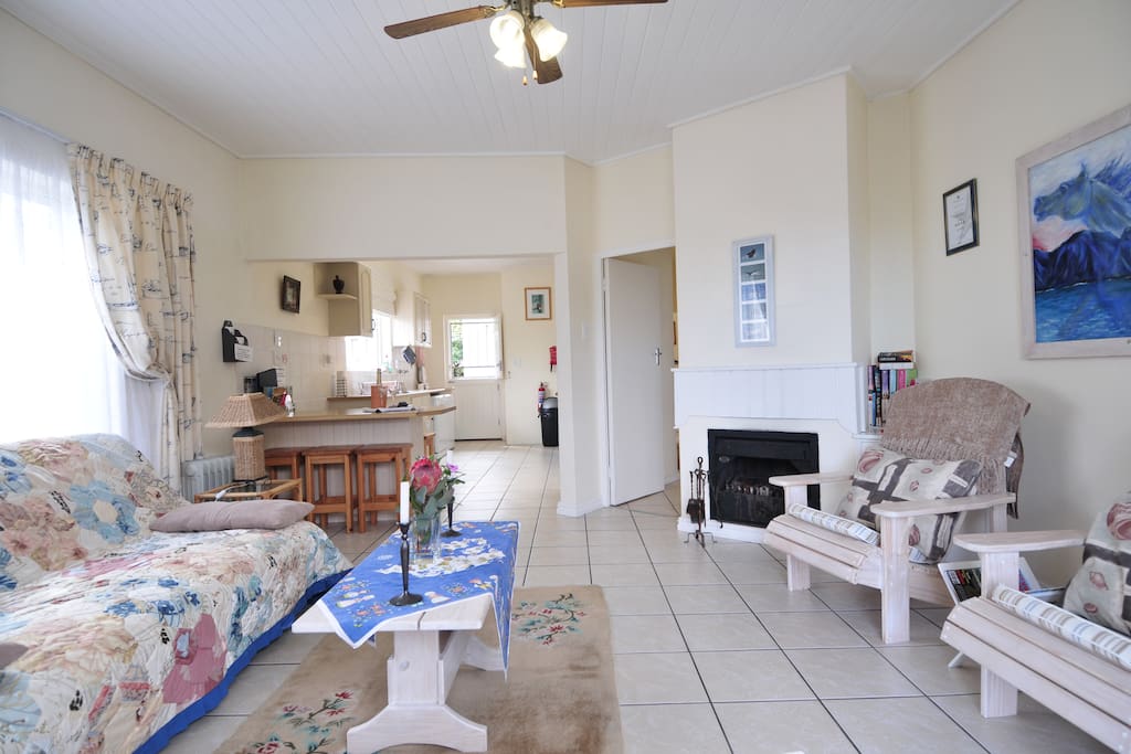 Open plan lounge/kitchen area with fireplace