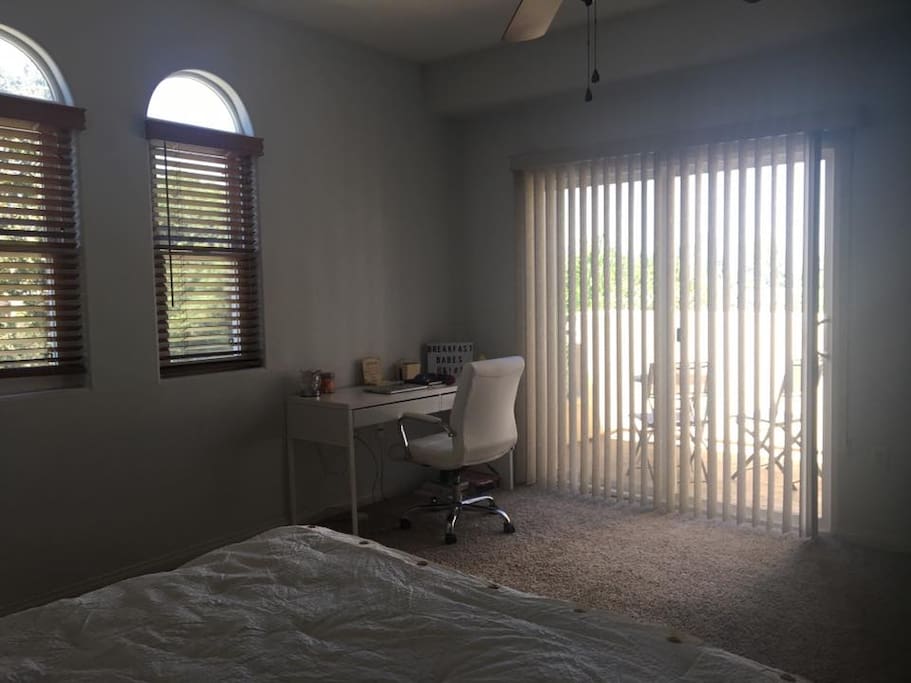 Private bedroom with desk and balcony