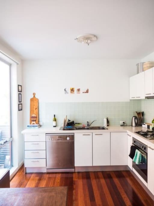 Cute open kitchen with all the basics and a gas stove