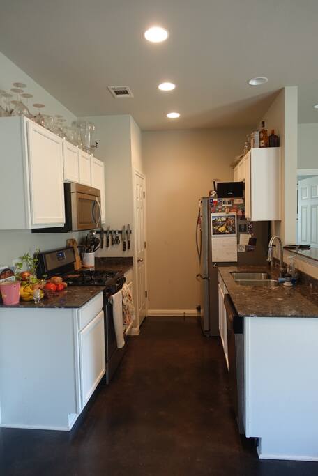 gas stove. dishwasher. full assortment of utensils for cooking.