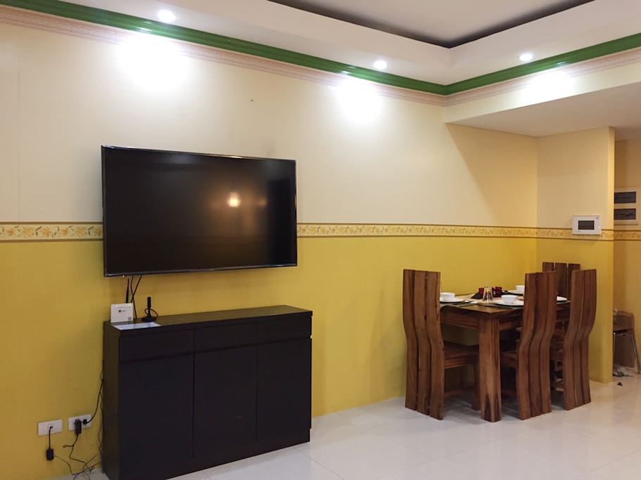 Living Area - Full HD 55"TV
Dining Area - 4 wooden chairs and 1 big table