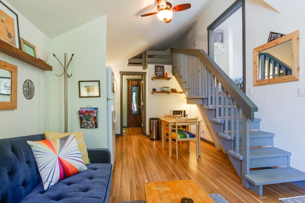 Looking into the space from the living area - the steps lead up to the bedroom quarters and bonus loft space. The bathroom is just beyond the kitchen area.