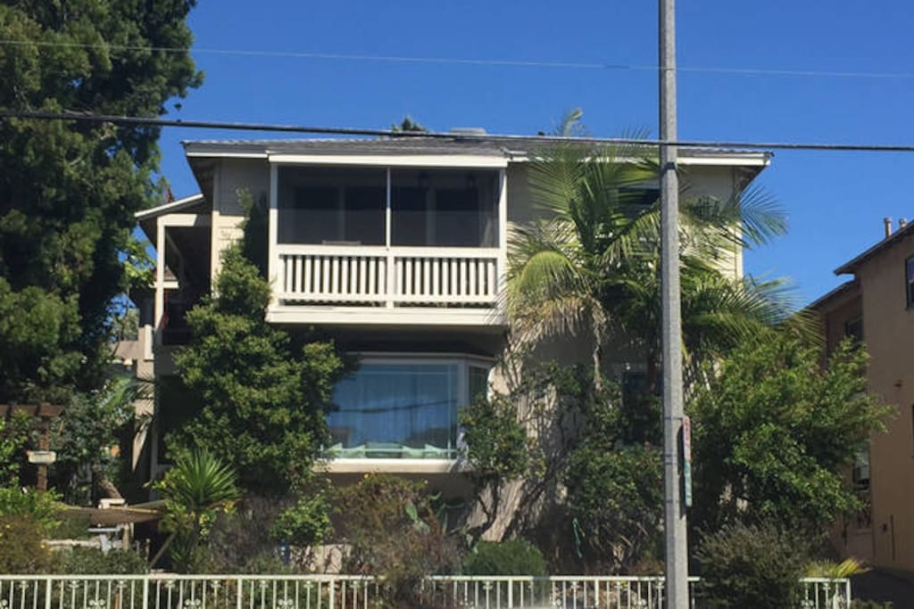 Outside of building. The apartment is the upper front unit, you are looking it its balcony. Entrance on the right by the driveway.