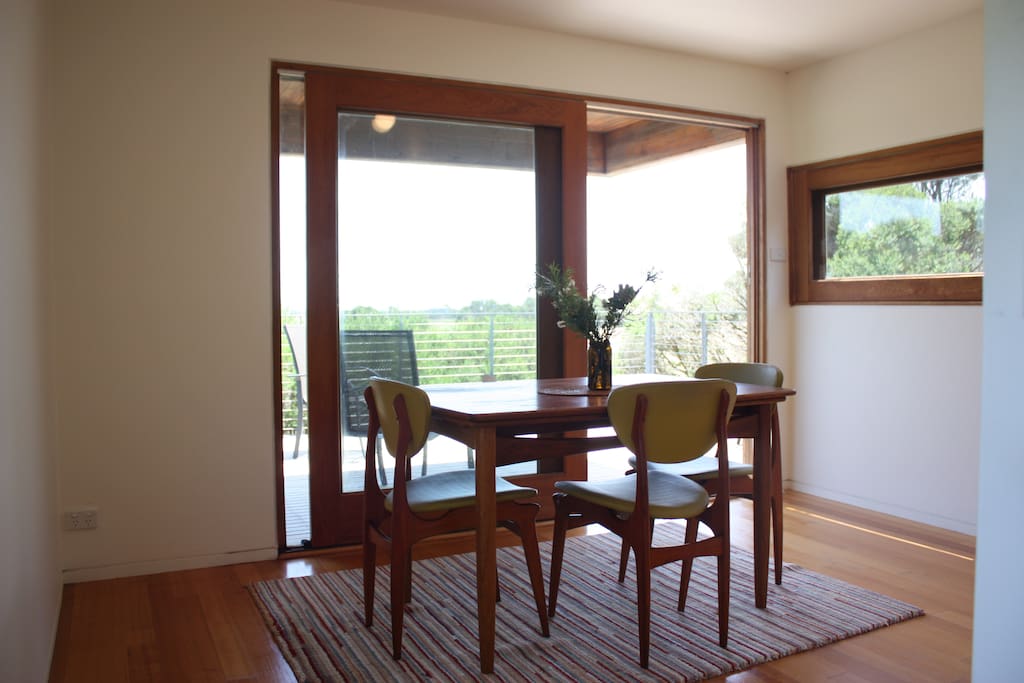 The dining area overlooks the upstairs deck.