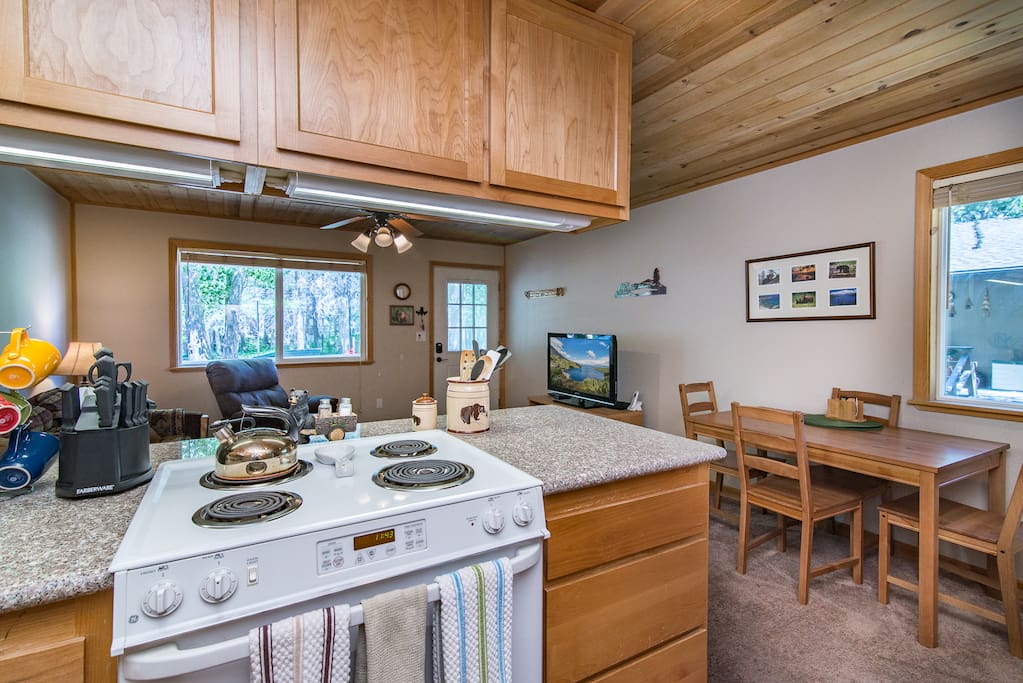 An open kitchen looks out over the living and dining areas for a true group vacation.