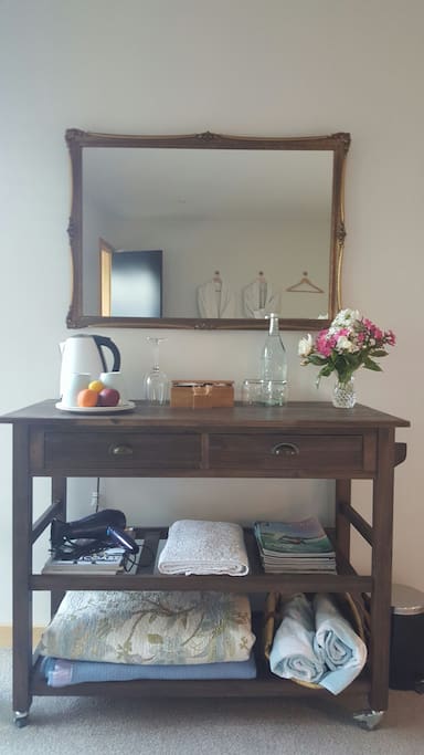 Sideboard with refreshments,fruit, flowers ...its the little things...