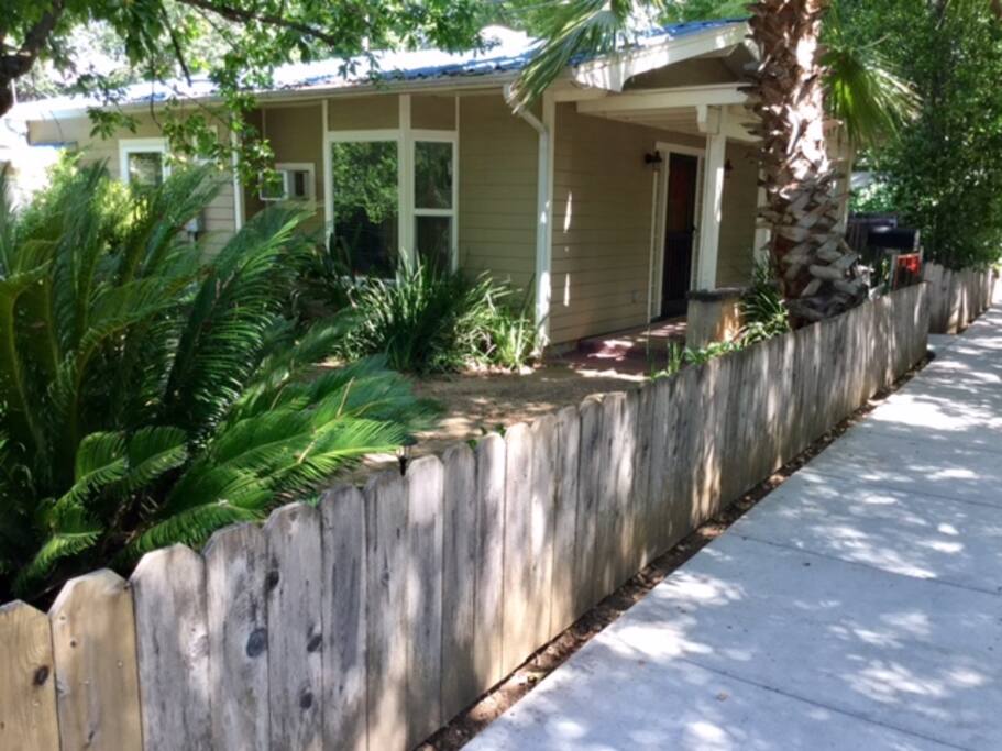 Left side of house.