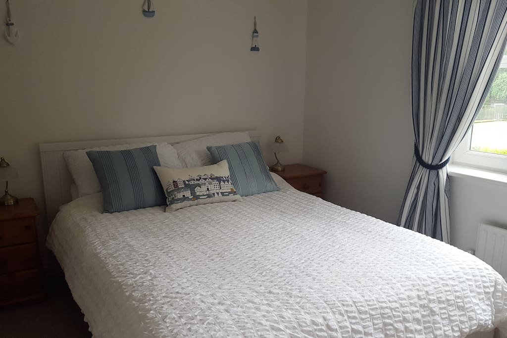 Bedside tables provide extra storage