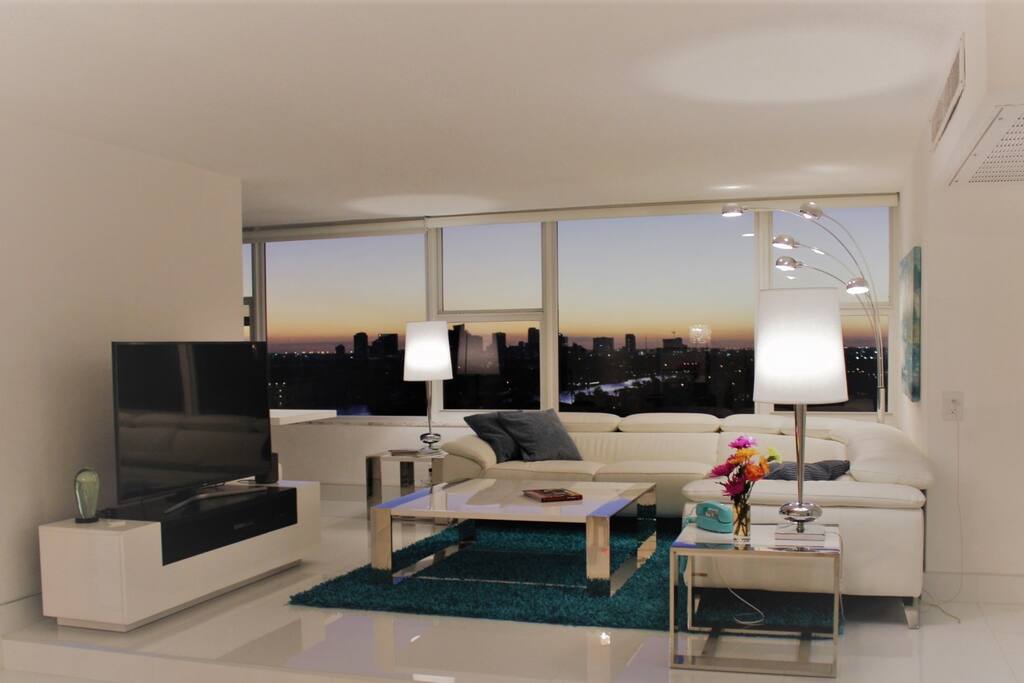 Intracoastal and city views from contemporary living room