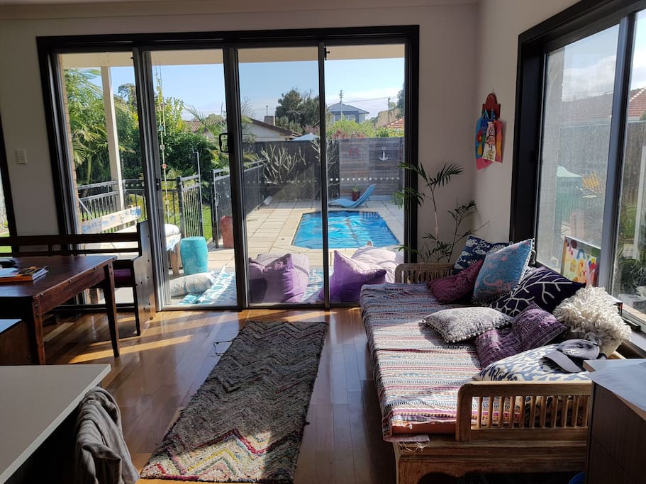 open living looking out over pool and garden