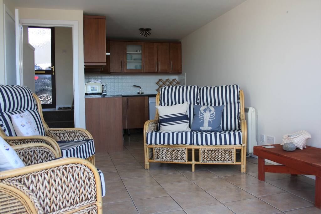Living room with wood burner, and balcony