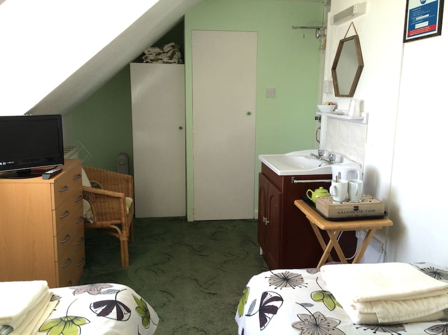 Room 6 - Twin room, sea view, toilet bathroom is shared on the floor below. Room is at the top of a steep staircase.