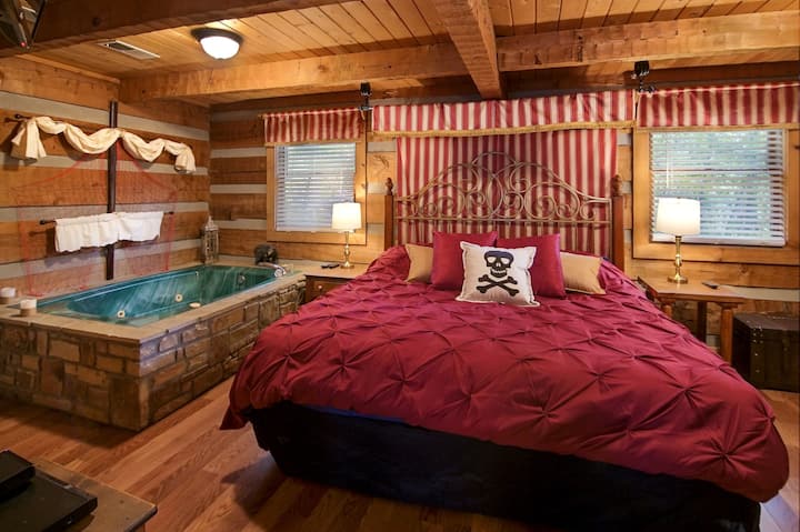 Romantic king bed fit for a pirate or YOU! Nightstand lamps have USB chargers in base.
*Unfortunately, jets no longer work due to the unavailability of parts to repair the motor. 