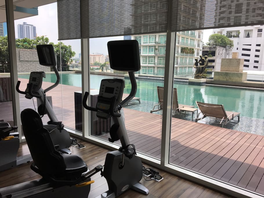 Fitness with swimming pool view