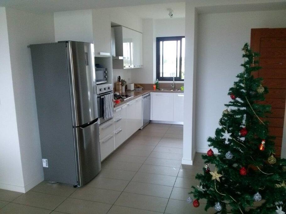 Kitchen with opening into laundry leading on to the front veranda