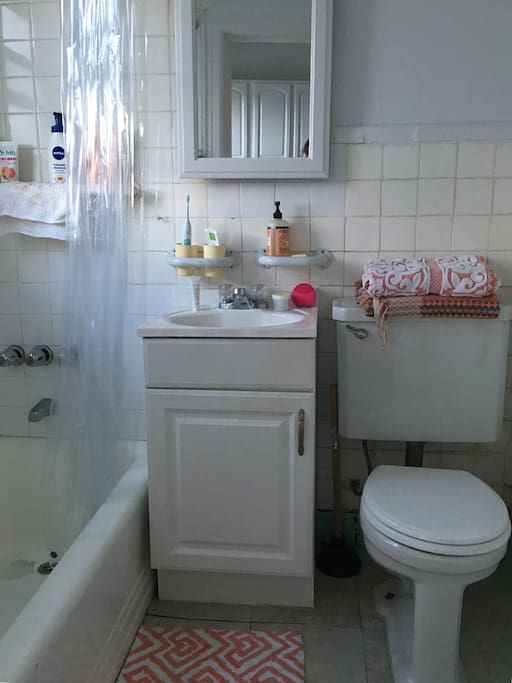 Bathroom with fresh linens, toilet paper, and Mrs. Meyers soap.
