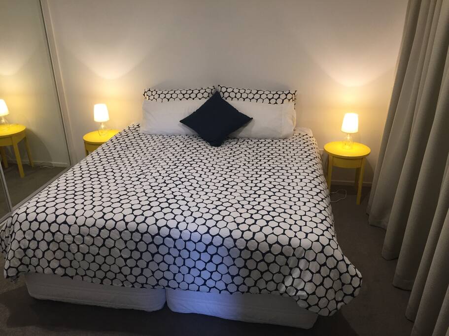 Main Bedroom - Large Bedroom with Super King Bed and mirrored wardrobe the length of the room. Bed can also be converted to twin singles on prior request. But just in case you're wondering, you wouldn't know when you're sleeping on the King as a luxurious Memory Foam topper means you feel like you're sleeping on a continuous cloud!