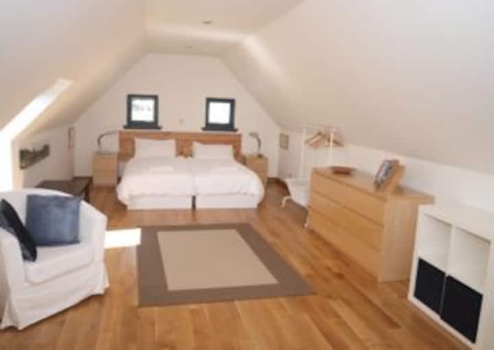 Sleeping accommodation consists of a large upper double bedroom with views to the Applecross peninsula. 