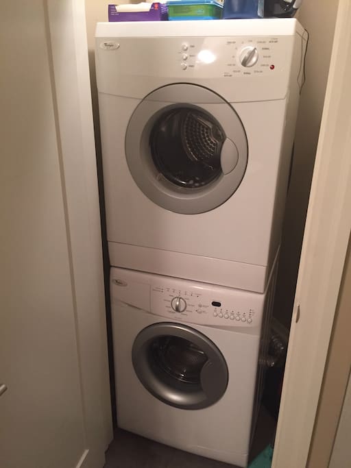 En suite laundry with washer and dryer.