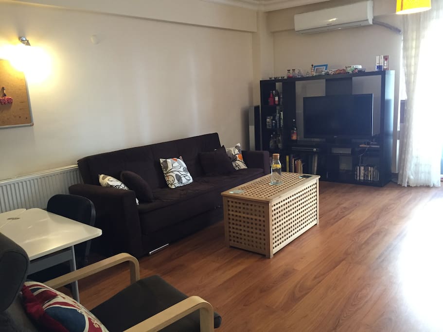 Living area with comfy sofa and TV
