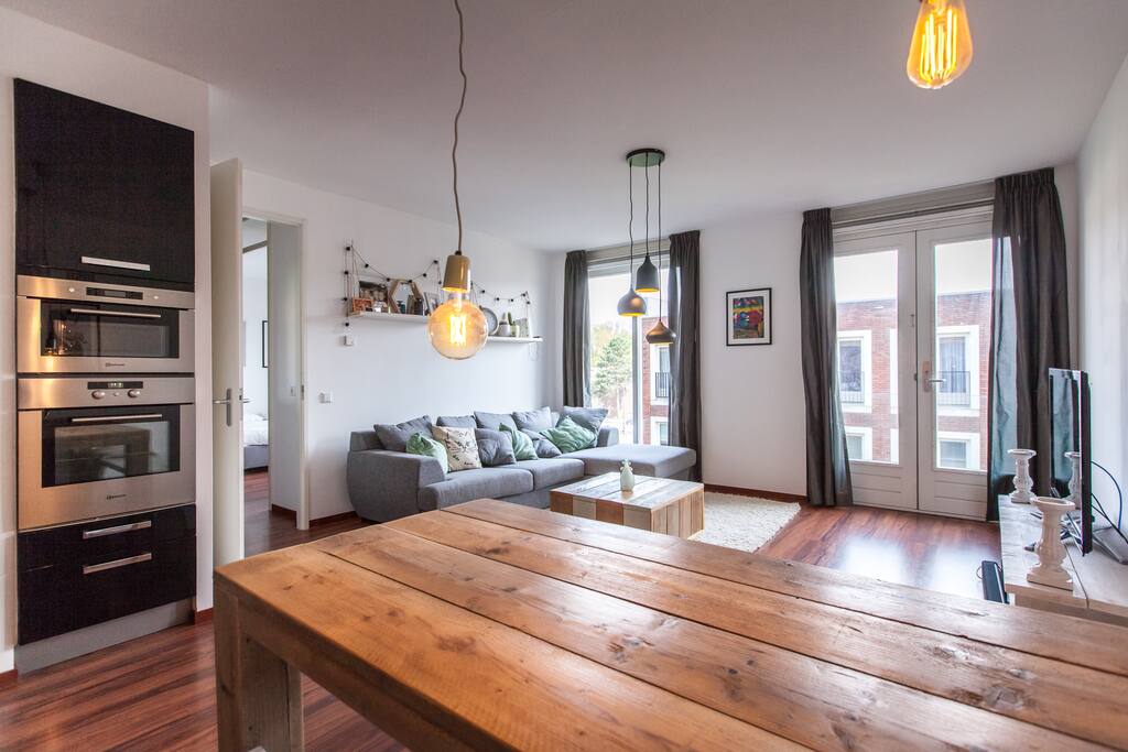 Living room + part of the kitchen with build in oven and micro wave