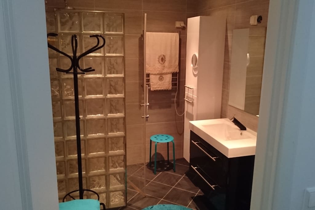 Bathroom with Shower, heated floor and towel-dryer.