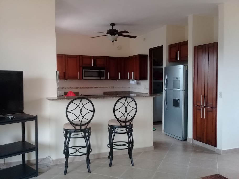 Big kitchen with all kitchen ware including coffee maker, microwave, dishwasher