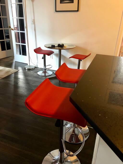 Kitchen Bar: Separates the open-concept Living Room from the Kitchen.