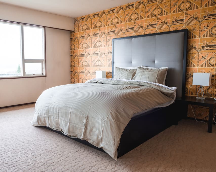 The quirky, trend master bedroom expands across a third of the floor. With an abundance of space, a large walk-out deck, and two closets, this bedroom is an amazing place to spend your nights. The custom designer bed frame holds the ultra-comfort mattress to combine stylish and comfort. The high quality sheets ensures an amazing sleep for guests.