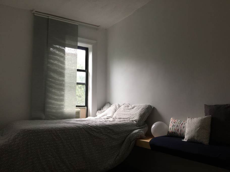 Your room features a full size mattress that sleeps up to two people, an air conditioner, track curtains, a bedside lamp, as well as a seating bench and television, and a work desk.