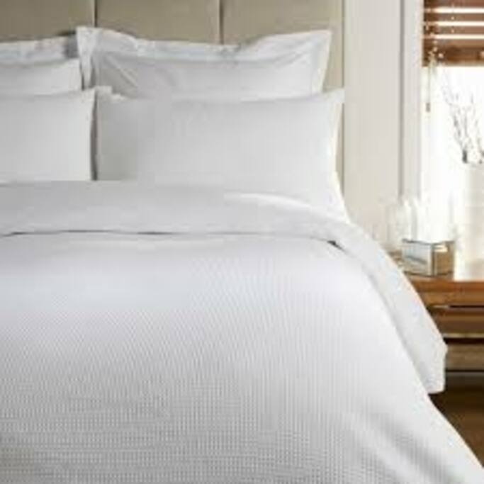 Queen bed and single in bedroom
