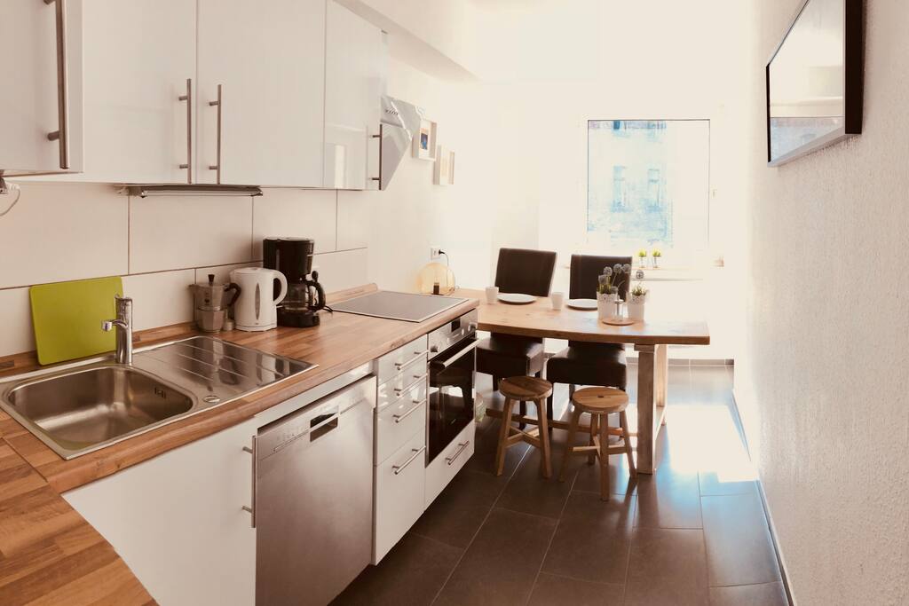 Big kitchen with the entrance to the terrace