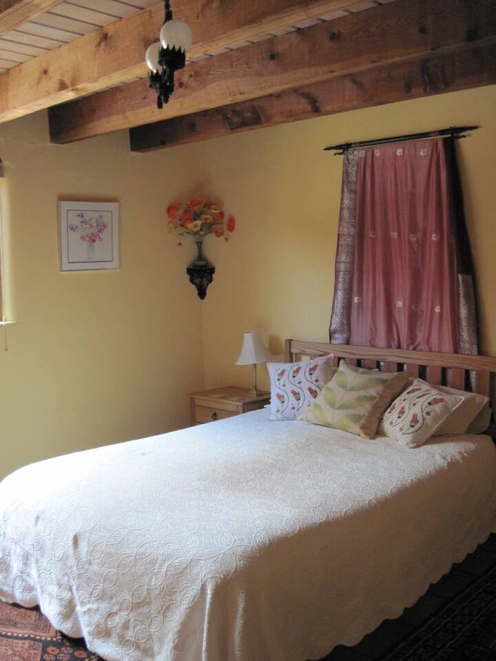 this is the bedroom with the queen size bed and one of my watercolors on the wall.